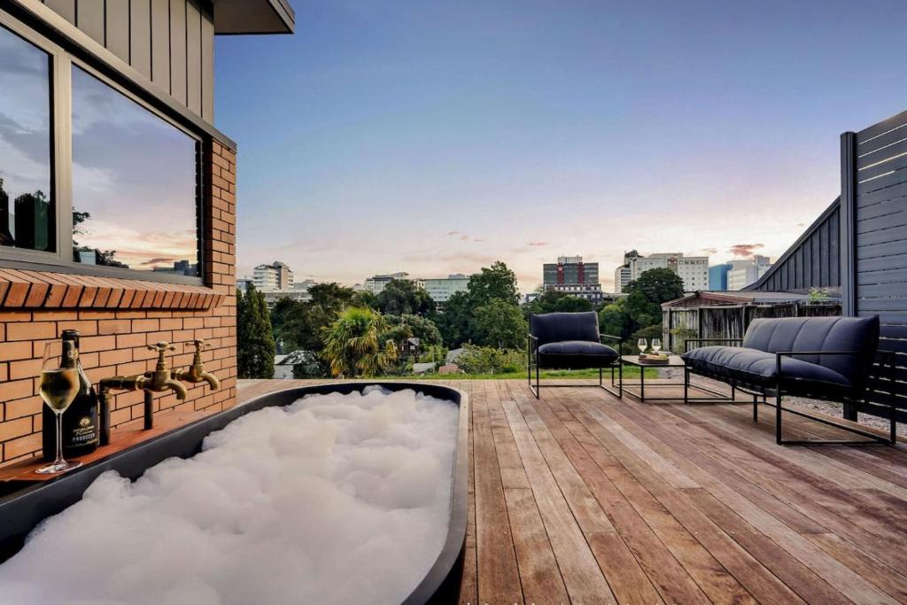 Hamilton East Villa | Luxe Retreat, Outdoor Tub with City Views -By KOSH