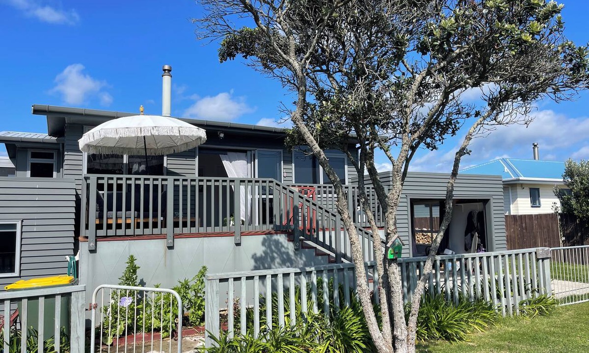 Pukehina House | Pukehina beach house: Estuary views + Outdoor bath