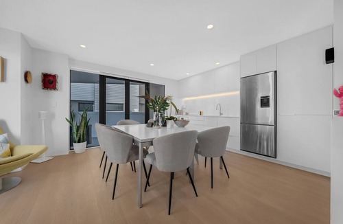 Ponsonby House | A light-filled Ponsonby townhouse. Open-plan living opens to a sheltered balcony, with a restful queen bedroom and a separate TV lounge to retreat to. Step outside and you're spoilt for choice: Ponsonby Road's cafés, shops and restaurants.