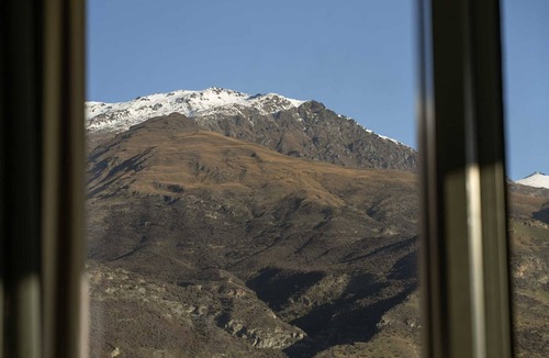 Arrowtown House | Alpine Solitude - your private slice of Central Otago framed by sweeping peaks and wide-open skies.