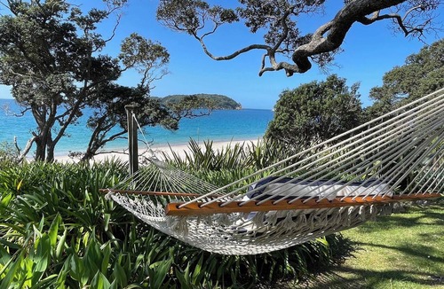 Hahei House | Beachfront Bliss, relax in the hammock and listen to the waves on your door step