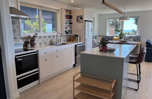 Papamoa Beach House | Beachfront- Laid back, quintessential Kiwi bach.