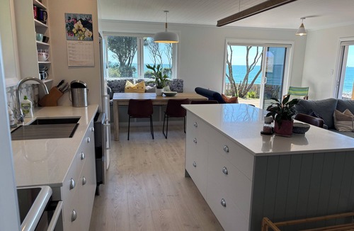 Papamoa Beach House | Beachfront- Laid back, quintessential Kiwi bach.