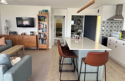 Papamoa Beach House | Beachfront- Laid back, quintessential Kiwi bach.