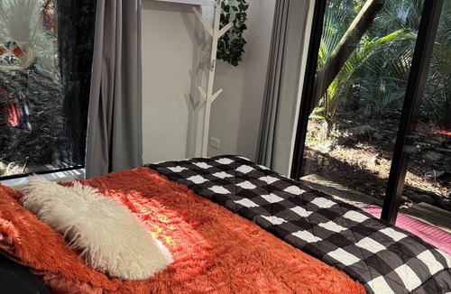 Titirangi Bed & Breakfast | Heritage reserve hideaway.Bush all around. One Bed-ground floor of our home