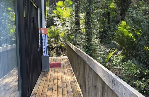 Titirangi Bed & Breakfast | Heritage reserve hideaway.Bush all around. One Bed-ground floor of our home