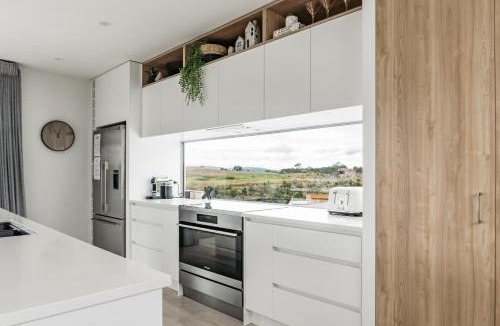 Raglan House | Hillside Haven, Design-led Beach Escape