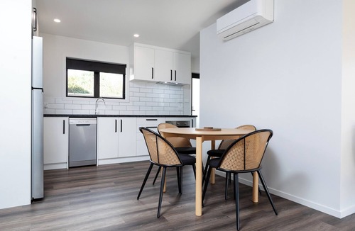 New Plymouth House | Kick back and relax in this calm, stylish space.