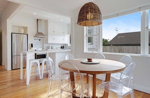 Massey House | Massey East Haven | Sunlit Verandah and AC Comfort