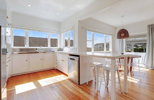 Massey House | Massey East Haven | Sunlit Verandah and AC Comfort