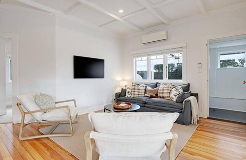 Massey House | Massey East Haven - Sunlit Verandah and AC Comfort
