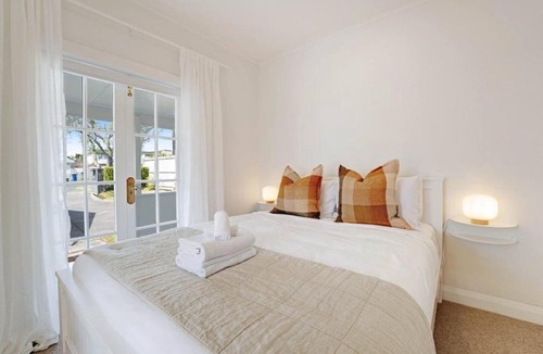 Massey House | Massey East Haven - Sunlit Verandah and AC Comfort