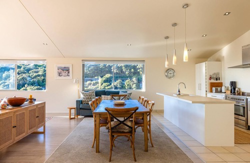 Palm Beach Villa | Miro Ridge in Palm Beach - Miro Ridge is a spacious elevated holiday home overlooking Palm Beach with sea views and generous indoor-outdoor living. Large sliding doors open to an expansive deck, while the open plan lounge and entertainer’s kitchen cr
