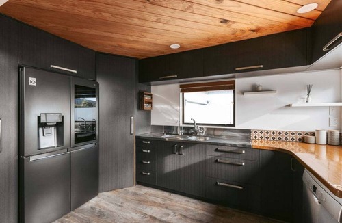 Mount Maunganui House | Ocean Grove - Relaxed Coastal Home with Spacious Living, Unique Character, Outdoor Entertaining, Prime Beachside Location, and Comfortable Accommodation for Up to 10 Guests