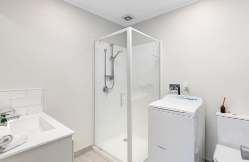 Castor Bay House | Oceanview Oasis in Auckland with Pool & Balcony