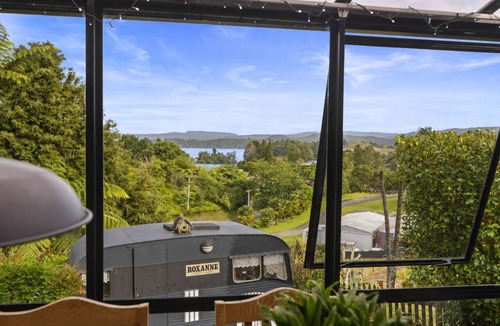 Okere Falls House | ŌKERE Ridge - Stone, native timber and tree ferns overlooking Lake Rotoiti