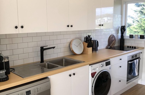 Paraparaumu Beach Apartment | RECENTLY RENOVATED PROPERTY RIGHT ON THE SAND! NEW DECK AND FREE WIFI!