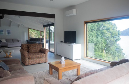 Huia House | Te Whare Huia - a stunning spacious home right on beautiful Huia Bay.