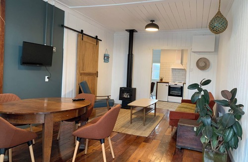 Opunake House | The Old Siren. An old shop by sea, for walkers, surfers, and slow mornings.