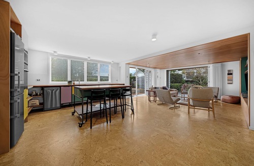 Devonport House | Walk to Village & Ferry is a beautifully designed ground-floor apartment offering the perfect combination of comfort, privacy, and convenience in one of Auckland's most sought-after seaside locations.