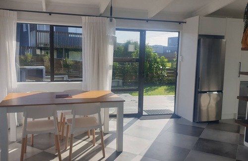 Mangawhai Heads House | WInter retreat, outdoor open fireplace. Indoor gas fireplace Inc LINEN & WIFI