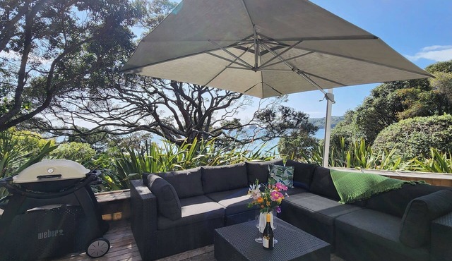 Beachfront Bliss, relax in the hammock and listen to the waves on your door step in Hahei