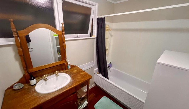 Room In flat is 1st door past carport