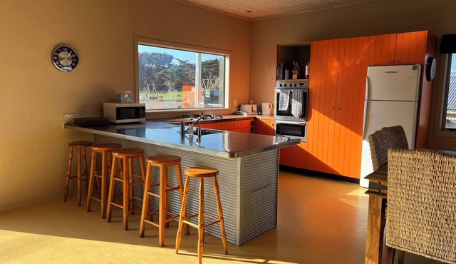 See and hear the surf from this fenced pet friendly property in Himatangi Beach