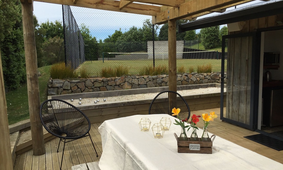 Raglan House | Okete Landing - Lifestyle retreat on Raglan harbour with grass tennis court.