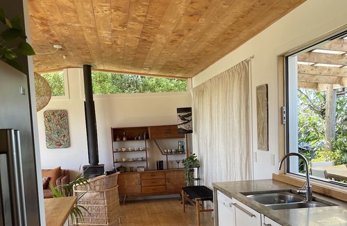 Oneroa House | Private. Sunny. Twin sea views, cedar tub, mediterranean gardens, flat lawns.