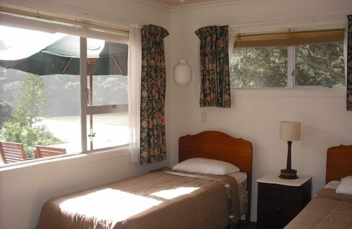 Whiritoa House | Walk straight onto the sand from the garden.