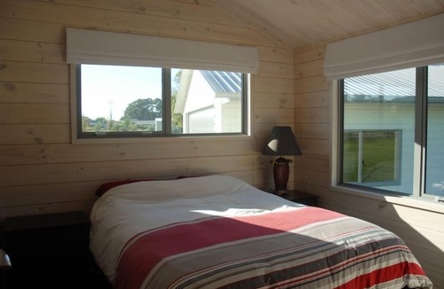 Wainui House | Peaceful Wainui Beach Holiday Home