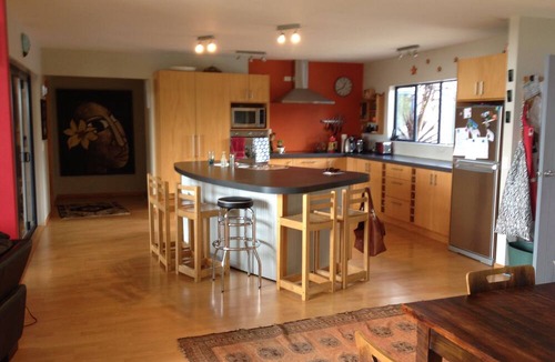 Raglan House | Okete Landing - Lifestyle retreat on Raglan harbour with grass tennis court.