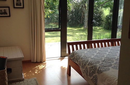 Raglan House | Okete Landing - Lifestyle retreat on Raglan harbour with grass tennis court.