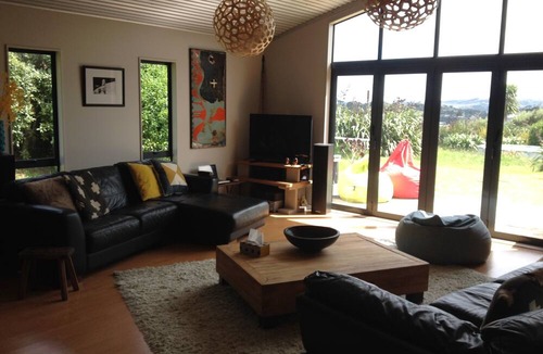 Raglan House | Okete Landing - Lifestyle retreat on Raglan harbour with grass tennis court.