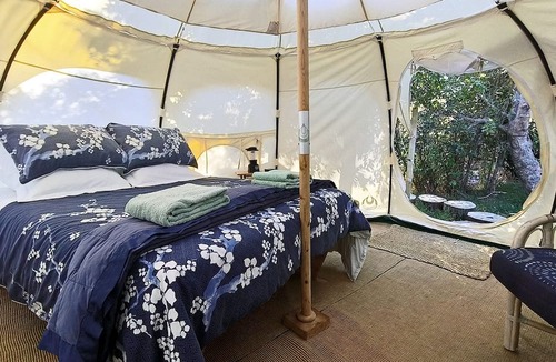 Oneroa RV Rental | Secluded Island Glamping Retreat with Outdoor Kitchen and Private Bathroom near Oneroa, Waiheke Island