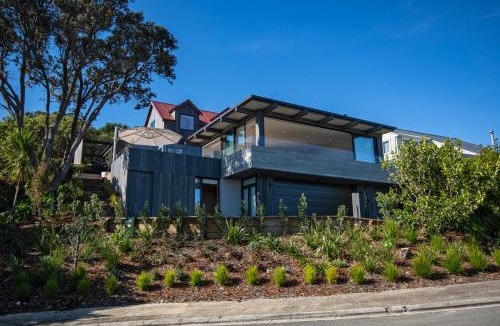Langs Beach House | Black House Red Roof - Langs Beach Holiday Home