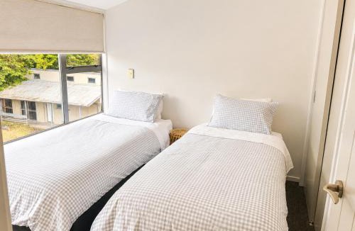 Two Mile Bay Apartment | Stylish Lakeside Apartment - Sleeps 4 - Lake & Pool views
