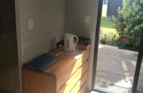 Matarangi Villa | Cozy Matarangi Cabin Garden and Lake views
