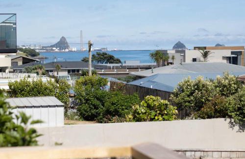 Rewa House | Blue Water Cottage - with beachfront coastal views