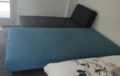 Epsom Ski Chalet | Three beds including 1 double bed, 1 double sofa bed, and 1 single sofa bed, Studio