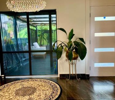 Papakura House | Stylish Home with Views, Spa & Outdoor Bliss