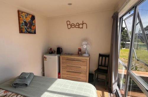 Matarangi House | Sunsets on Harbour Kauri or Totara Cabin