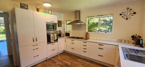 Pakawau House | Soggy Bottom Farm House, Sea views and peacocks